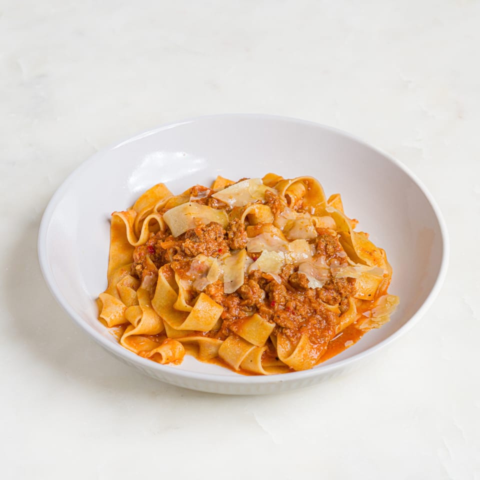 A'mano Fresh Pasta Kitchen's pappardelle pasta with rich bolognese sauce and shaved parmesan cheese.