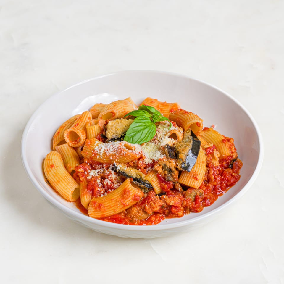 A'mano Fresh Pasta Kitchen's rigatoni pasta with red sauce, eggplant, parmesan, and basil.